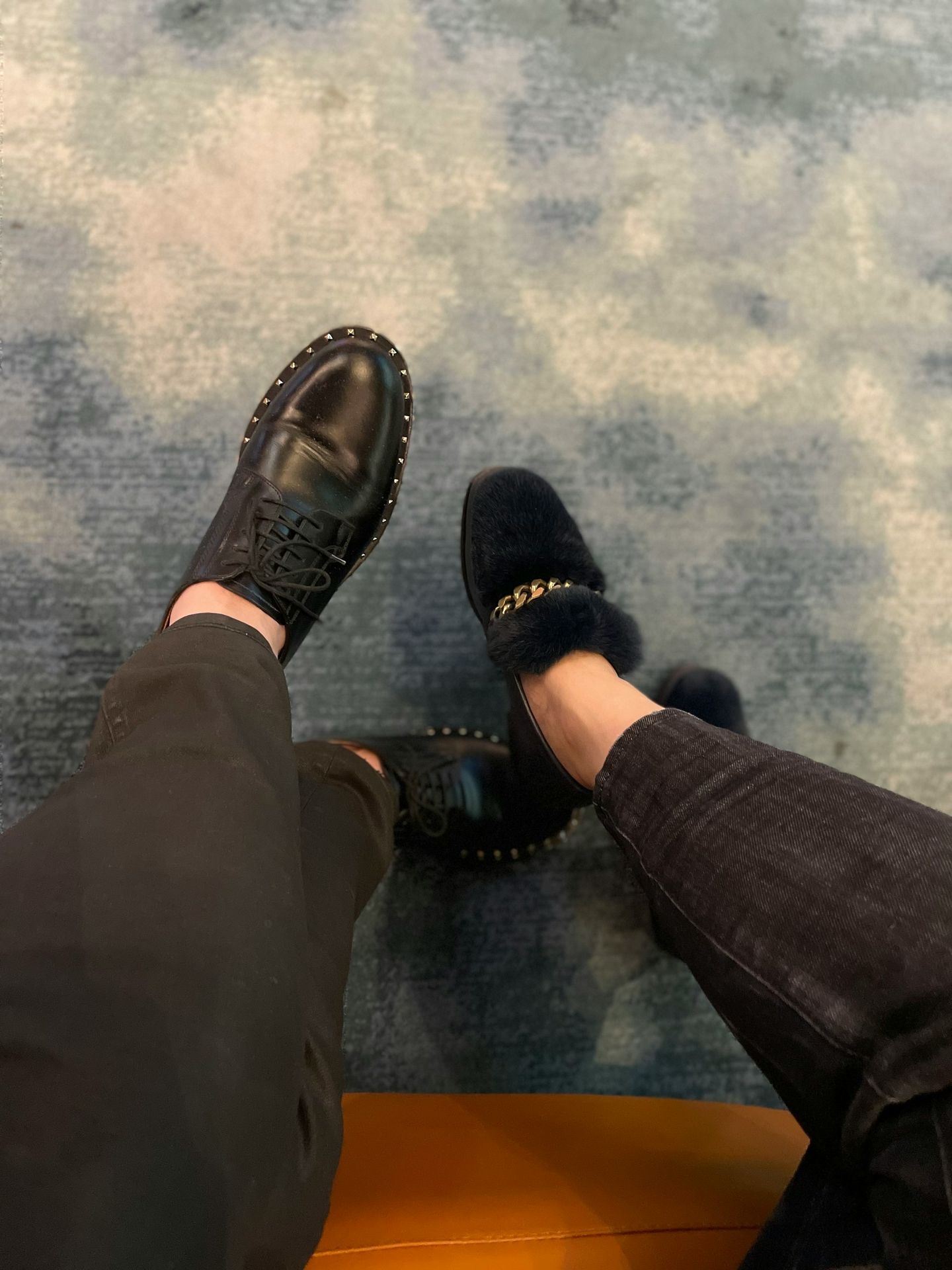 a person wearing black shoes and a pair of black pants